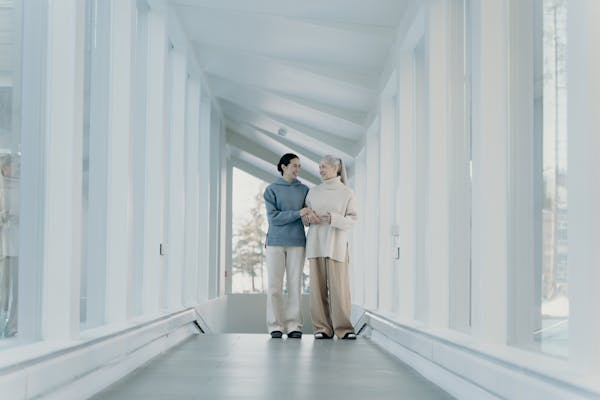 Elderly couple traveling with support from family