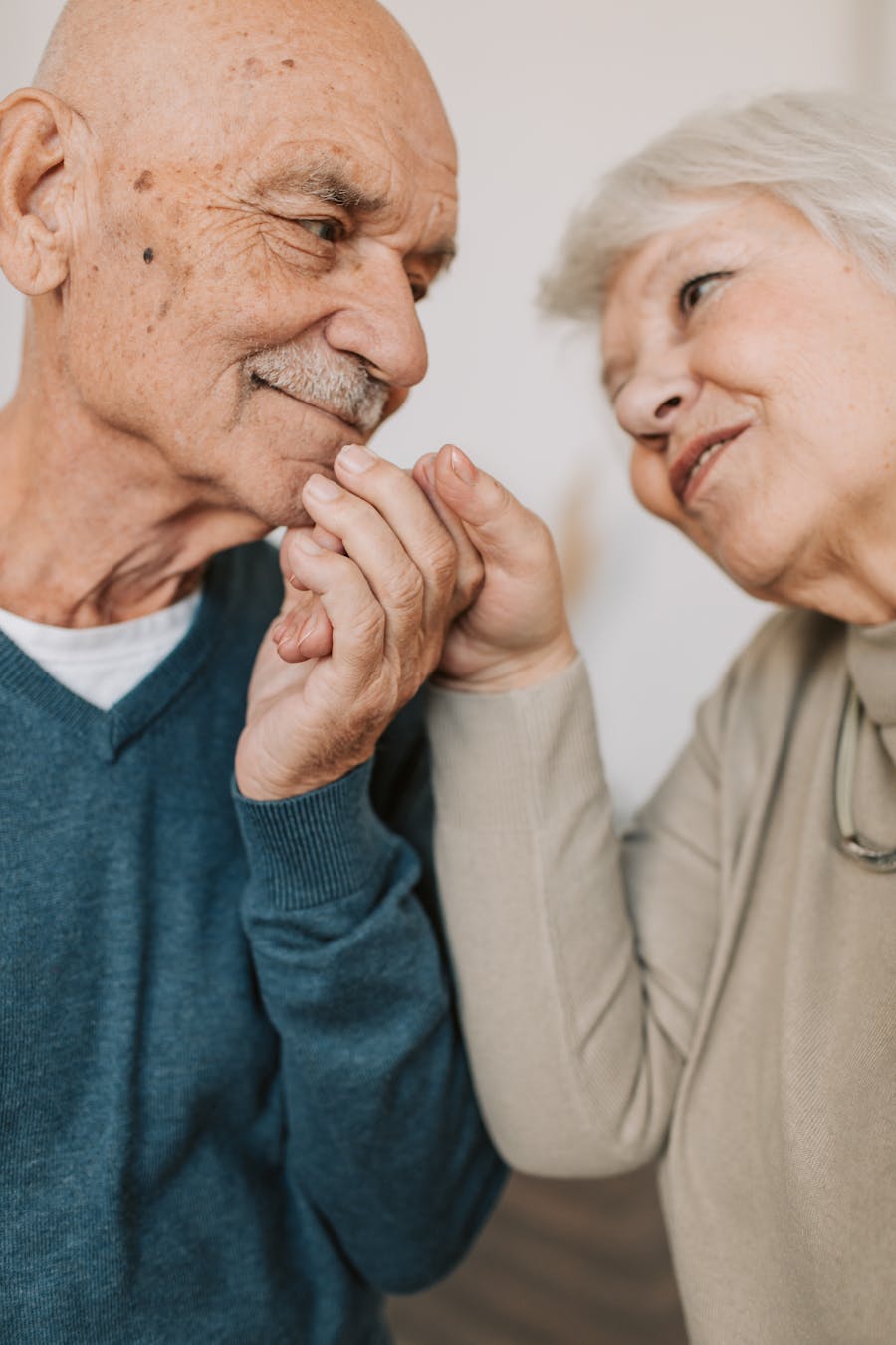 Elderly couple sharing a supportive, caring moment